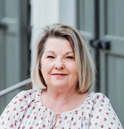 Portrait of Beth Hammond, Hearing Instrument Specialist at the Russellville clinic standing outdoors