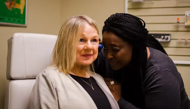 Nancy Wilson consults a patient