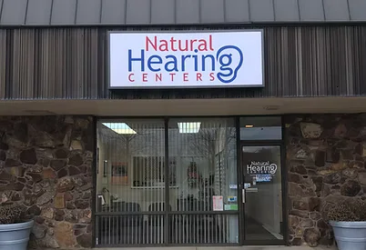 Front entrance of Natural Hearing Centers clinic with signage above the doorway