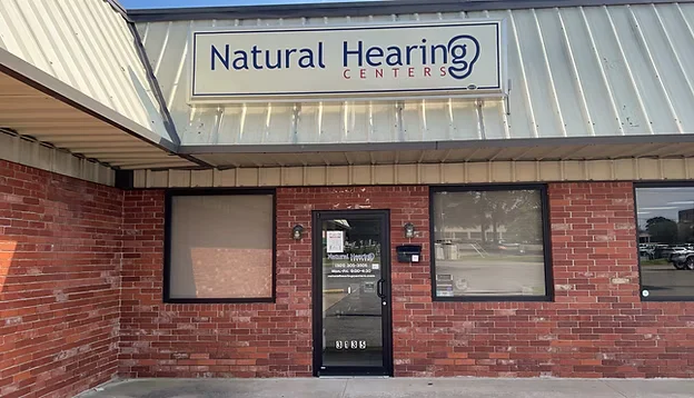 Natural Hearing Centers clinic exterior with signage and front entrance view