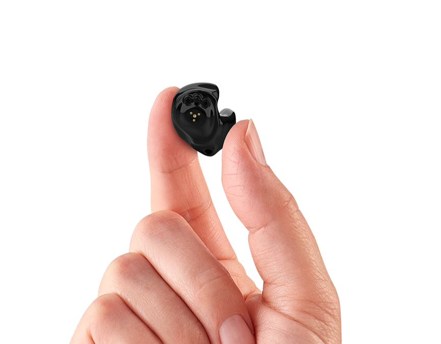 hand holding in the ear hearing aid