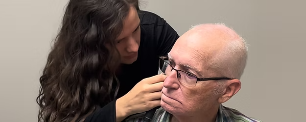 patient receiving ear cleaning
