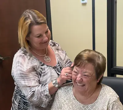 hearing aid fitting on patient
