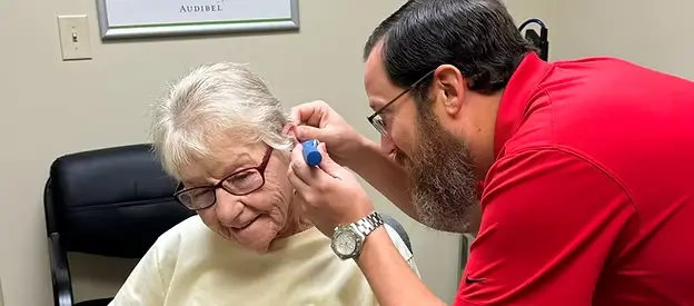 Chris Prince consults a patient